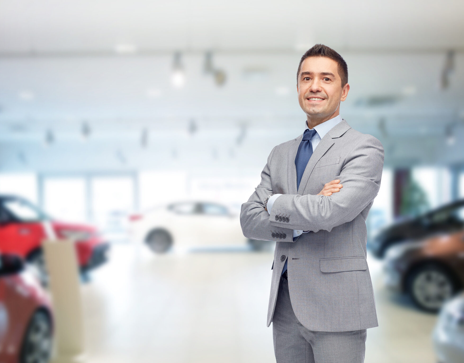 happy man at auto show or car salon