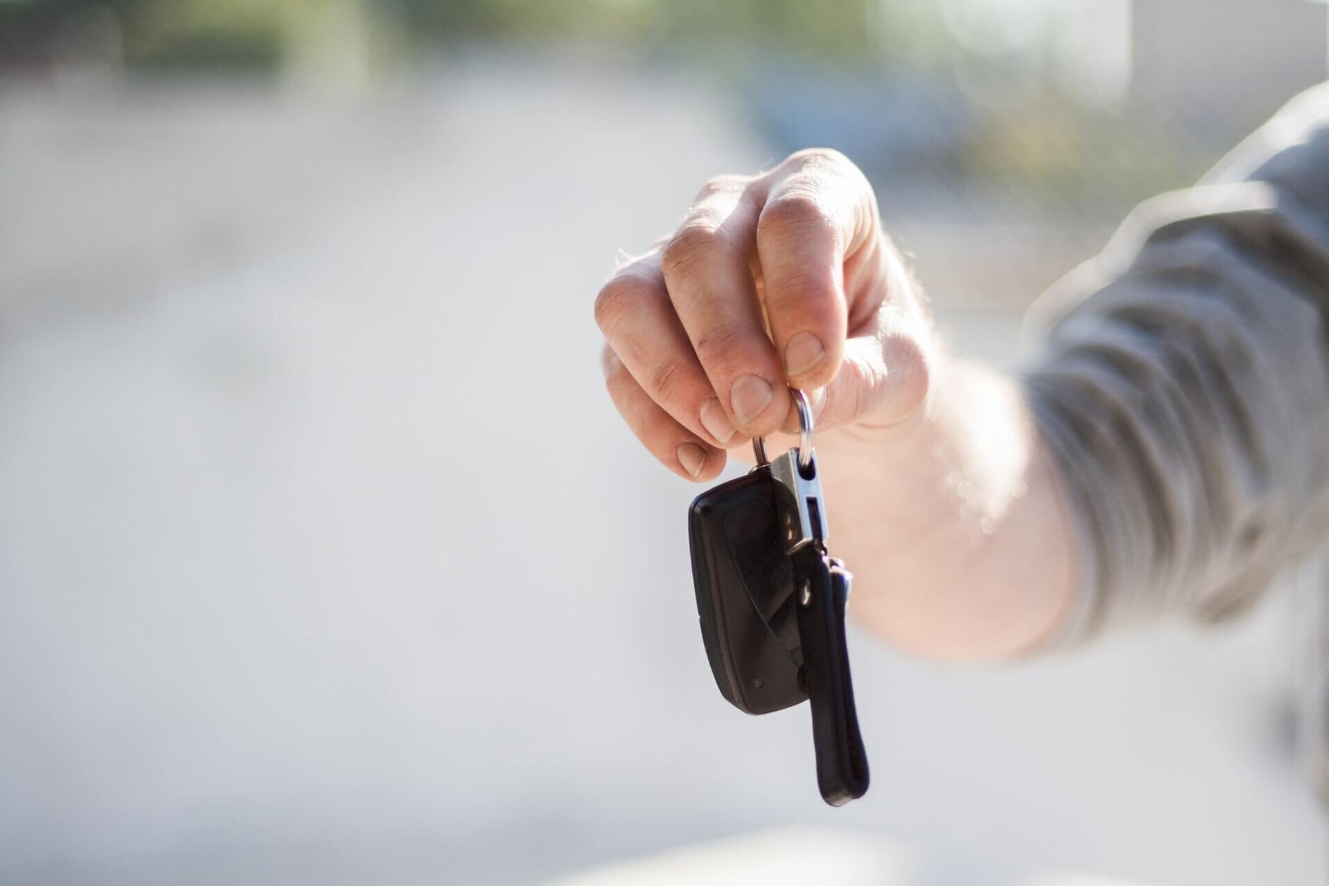 holding the keys to the car
