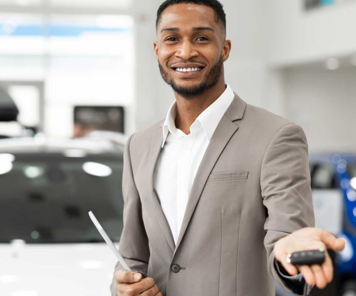 Car Dealer Offering Automobile Key